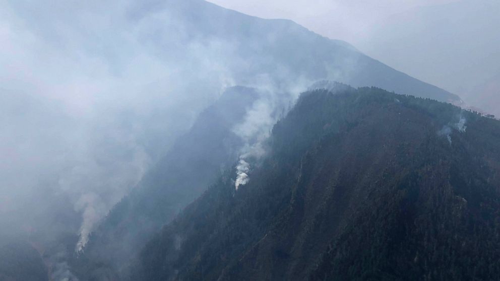 In this aerial photo released by Xinhua News Agency, smoke can be seen from a forest fire in Yalongjiang township of Muli County, Liangshan Yi Autonomous Prefecture in southwestern China's Sichuan Province on Monday, April 1, 2019. The fire high in t