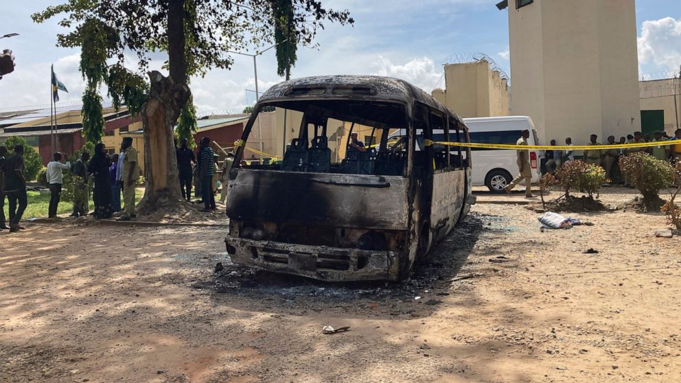 A burnt out bus is seen outside the Kuje maximum prison following a rebel attack in Kuje, Nigeria, Wednesday, July 6, 2022. At least 600 inmates escaped in a jailbreak in Nigeria's capital city, officials said Wednesday, blaming the attack on Islamic