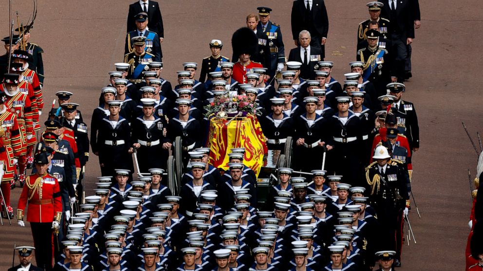 Queen Elizabeth II's funeral cortege borne on the State Gun Carriage of the Royal Navy travels along The Mall in London, Monday, Sept. 19, 2022. (Chip Somodevilla/Pool Photo via AP)