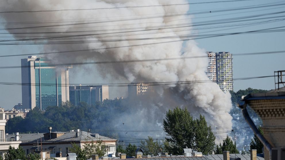 Smoke rises from a pyrotechnics warehouse in Moscow, Russia, Saturday, June 19, 2021. A large fire broke out at a fireworks depot in the center of Moscow. The fire is raging at the area of 500 square meters, Russia emergency services said in the stat