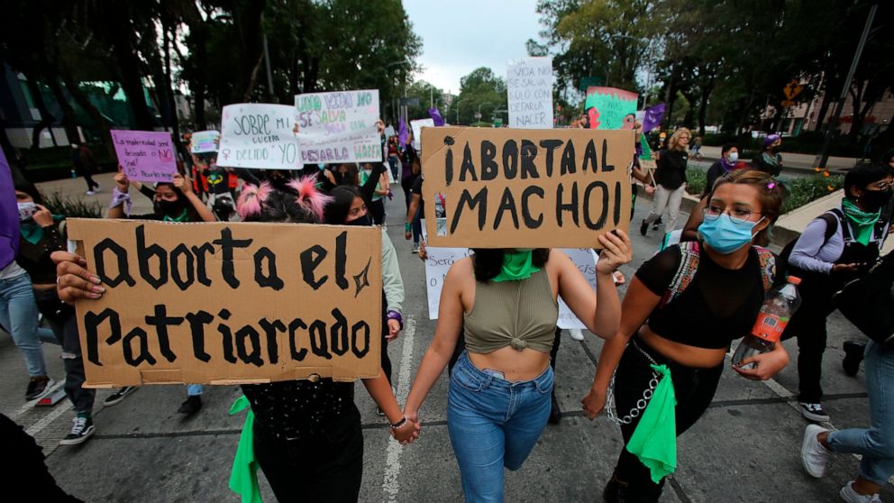 Women march in an abortion-rights demonstrators during the Day for Decriminalization of Abortion, in Mexico City, Tuesday, Sept. 28, 2021. (AP Photo/Ginnette Riquelme)