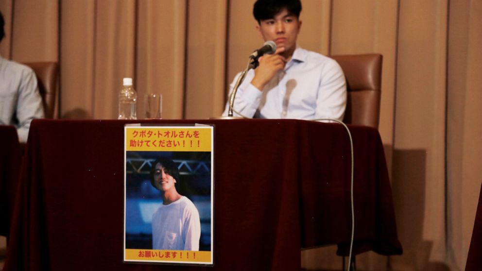 Images of Toru Kubota, a Japanese journalist detained in Myanmar while covering a protest, are displayed at the Japan Press Club in Tokyo, Wednesday, Aug. 3, 2022. Friends of Kubota gathered at the club calling for his immediate release. (AP Photo/Yu