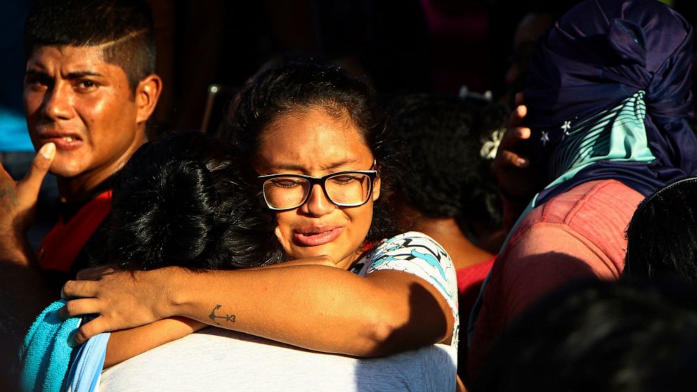 Women embrace outside Anisio Jobim Prison Complex after a deadly riot erupted among inmates in Manaus in the northern state of Amazonas, Brazil, Sunday, May 26, 2019. A statement from the state prison secretary says prisoners began fighting among the