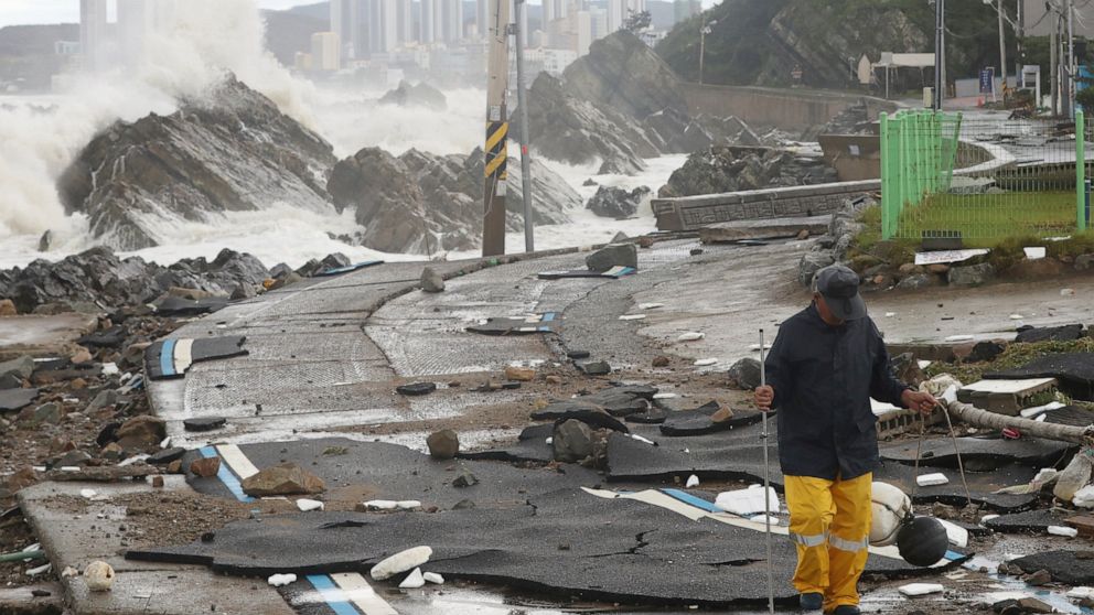 A road is damaged as waves hit a shore in Ulsan, South Korea, Tuesday, Sept. 6, 2022. The most powerful typhoon to hit South Korea in years battered its southern region Tuesday, dumping almost a meter (3 feet) of rain, destroying roads and felling po