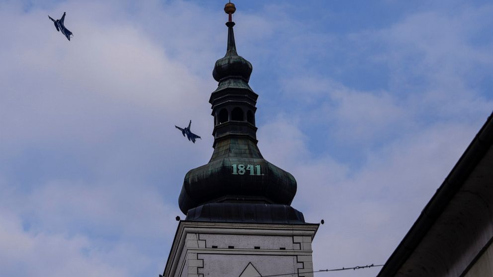 Two Dassault Rafale fighter jets fly next to a church after a signing ceremony between French President Emmanuel Macron and Croatia's Prime Minister Andrej Plenkovic in Zagreb, Croatia, Thursday, Nov. 25, 2021. Croatia's government has approved the p