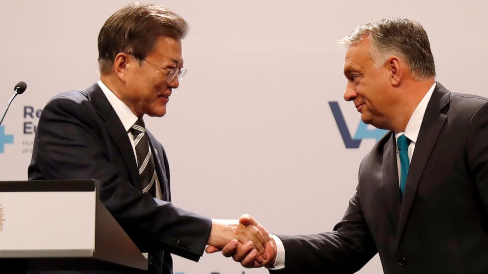 South Korea's President Moon Jae-in, left, shakes hands with Hungarian Prime Minister Viktor Orban during statements after a meeting of central Europe's informal body of cooperation called the Visegrad Group or V4, in Budapest, Hungary, Thursday, Nov