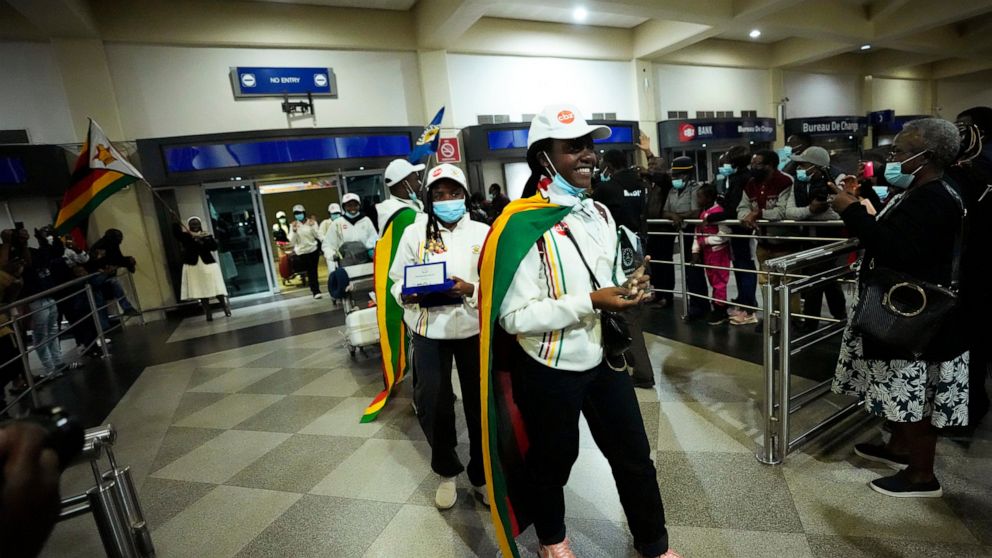 Zimbabwean high school World and European moot court competition champions arrive back at the Robert Mugabe International airport in Harare, Thursday, July, 7, 2022. A history-making team of Zimbabwean high school students that became world and Europ