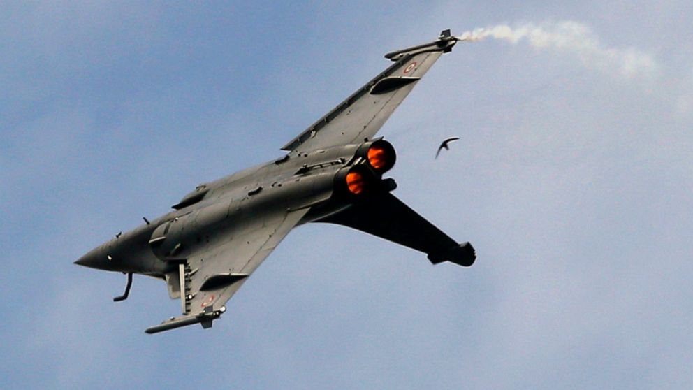 FILE- In this Tuesday, June 18, 2019, file photo, a Dassault Rafale fighter jet performs its demonstration flight at Paris Air Show, in Le Bourget, north east of Paris, France. Egypt is buying another 30 Rafale fighter jets from France, building up i