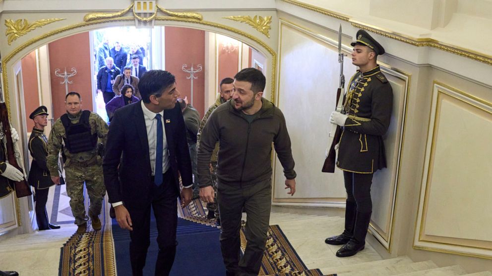 In this photo provided by the Ukrainian Presidential Press Office, Ukrainian President Volodymyr Zelenskyy, right, walks with British Prime Minister Rishi Sunak during their meeting in Kyiv, Ukraine, Saturday, Nov. 19, 2022. (Ukrainian Presidential P