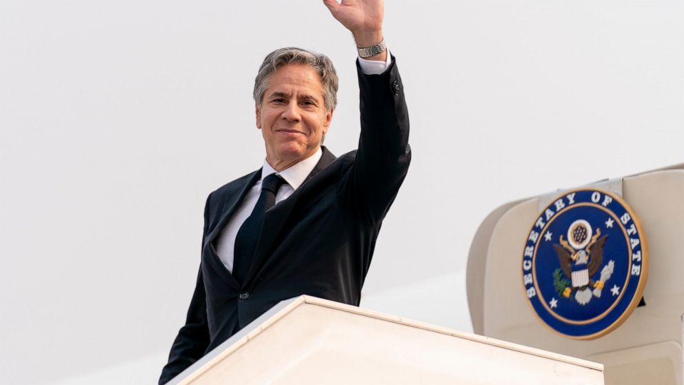 Secretary of State Antony Blinken waves as he boards his plane at N'Djili International Airport in Kinshasa, Congo, Wednesday, Aug. 10, 2022, to travel to Rwanda. Blinken is on a ten day trip to Cambodia, Philippines, South Africa, Congo, and Rwanda.