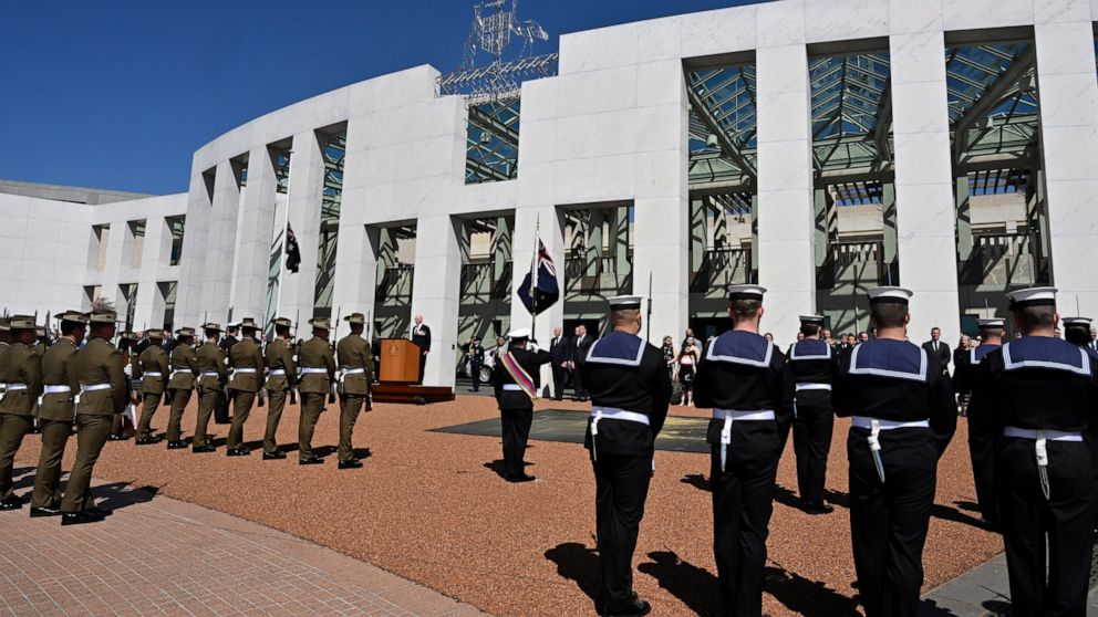 Australia's Governor-General David Hurley, center back, speaks at the proclamation of King Charles III, on the forecourt of Parliament House in Canberra, Sunday, Sept. 11, 2022. Australia's Prime Minister Anthony Albanese defended a protocol that bar
