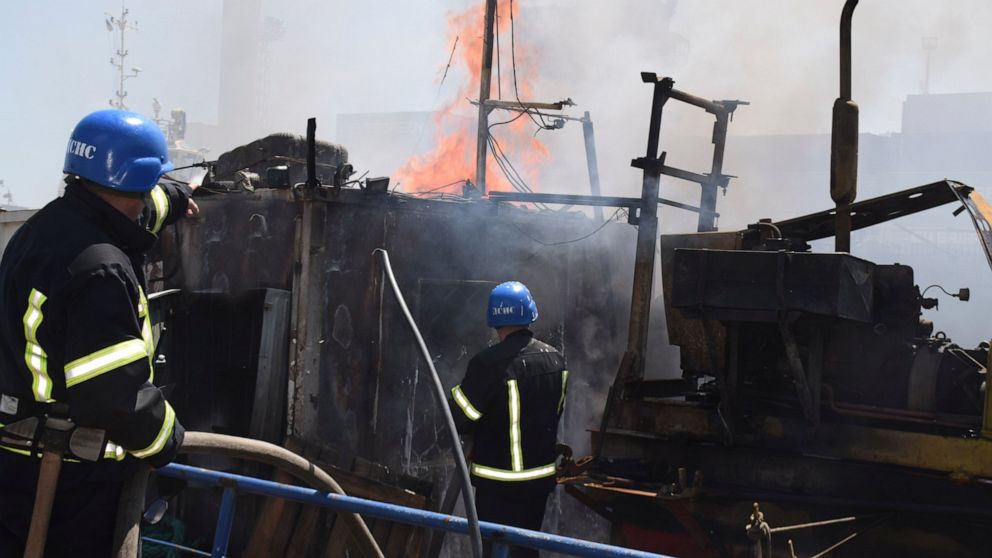 In this photo provided by the Odesa City Hall Press Office, firefighters put out a fire in a port after a Russian missiles attack in Odesa, Ukraine, Saturday, June 5, 2022. (Odesa City Hall Press Office via AP)