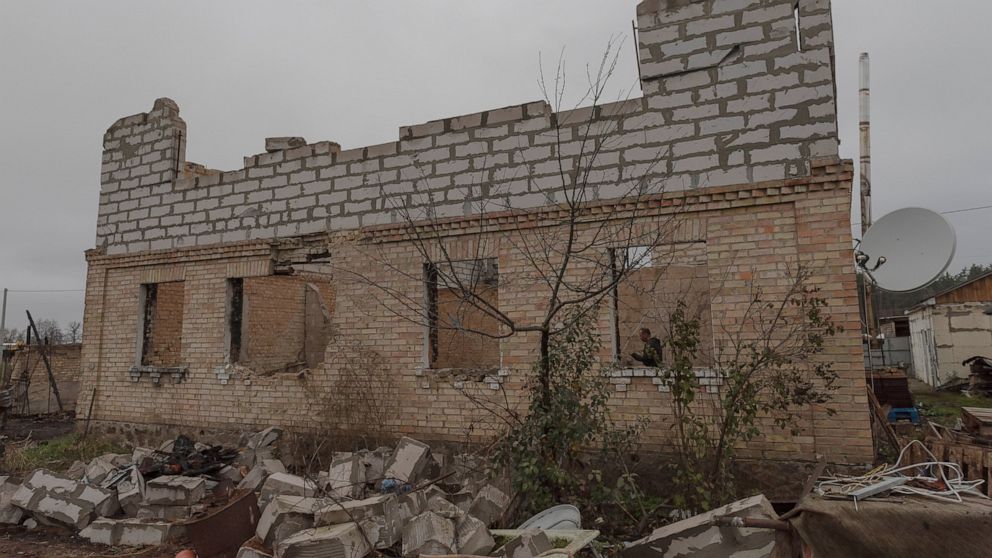 Vadym Zherdetsky stands in the remains of his house destroyed by fighting, in the village of Moshun, outside Kyiv, Ukraine, Friday, Nov. 4, 2022. When Russia invaded Ukraine in February, two missiles struck Zherdetsky's home in the tiny village of Mo
