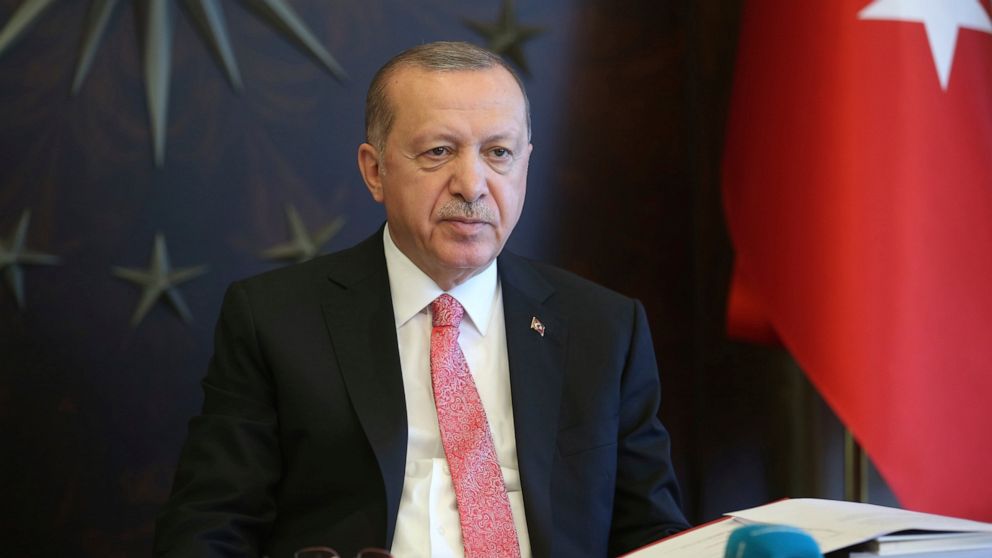 Turkish President Recep Tayyip Erdogan, listens during a teleconference with his cabinet in Istanbul, Monday, May 11, 2020. Erdogan announced a new four-day curfew to stem infections, that includes the weekend and a public holiday on May 19. The coun