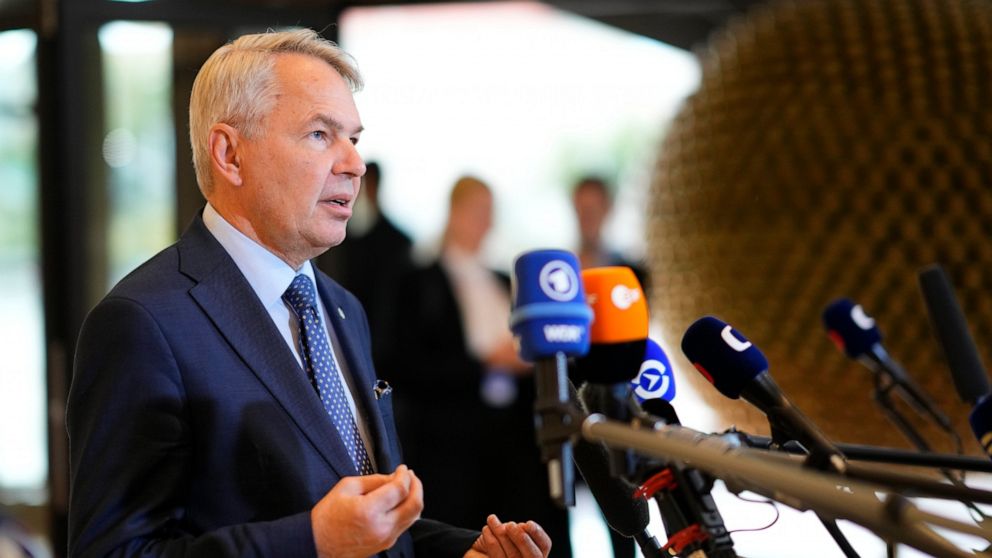 FILE - Finland's Foreign Minister Pekka Haavisto speaks with the media as he arrives for a meeting of EU foreign ministers at the Prague Congress Center in Prague, Czech Republic, on Aug. 31, 2022. Finland on Thursday Sept. 1, 2022 slashed the number