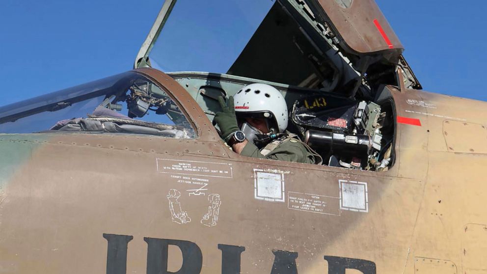 In this picture released by the official website of the Iranian Army, a pilot gestures during an air force exercise, in Iran, Thursday, Oct. 21, 2021. Iran on Thursday kicked off an annual air force drill across the country, a week after holding anot