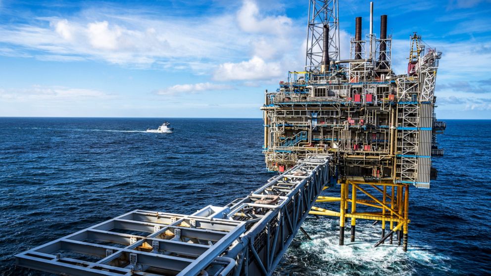 FILE - The Sleipner A gas platform, Norway, Oct. 1, 2022 as a Coast Guard ship patrols around the platform. Norwegian oil and gas workers normally don’t see anything more threatening than North Sea waves crashing against the steel legs of their offsh