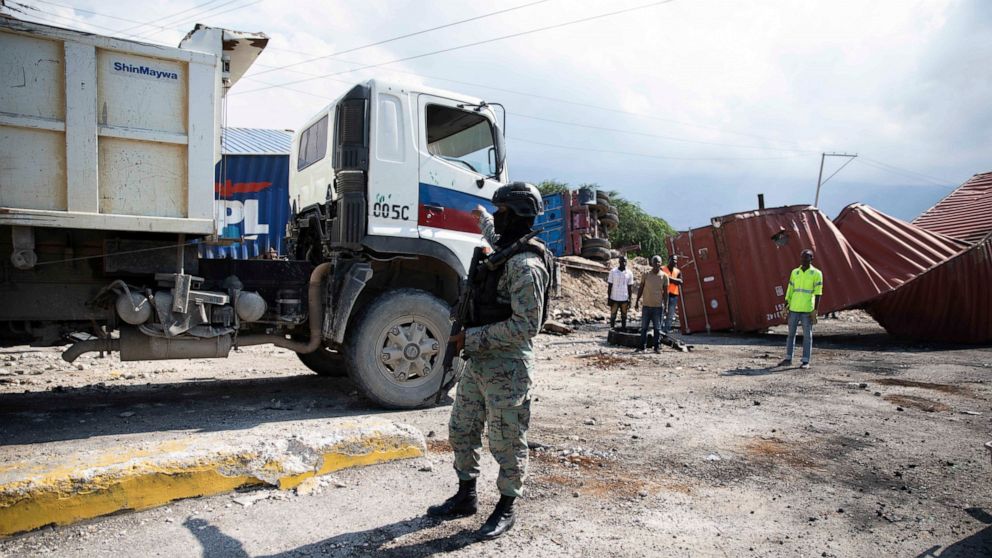 A member of the armed forces patrols the area of the Varreux fuel terminal in Port-au-Prince, Haiti, Monday, Nov. 7, 2022. Authorities seemed to have gained control of the key fuel terminal a day after a powerful gang leader announced that he was lif