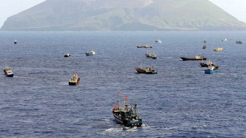 Foreign vessels, some of them have Chinese flags, fish near Torishima, Japan, on Oct. 31, 2014. A Chinese scientific ship bristling with surveillance equipment docked in a Sri Lankan port. Hundreds of fishing boats anchored for months at a time among