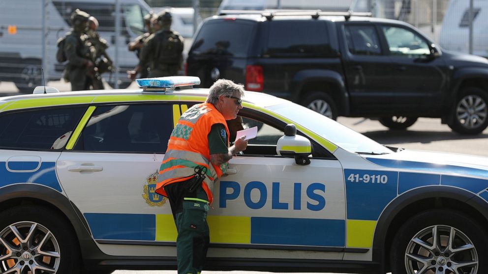 A large police operation is underway outside Hallby Prison near Eskilstuna, Sweden, on Wednesday July 21, 2021. Two inmates are reported to have taken staff members hostage inside the prison. (Per Karlsson / TT via AP)