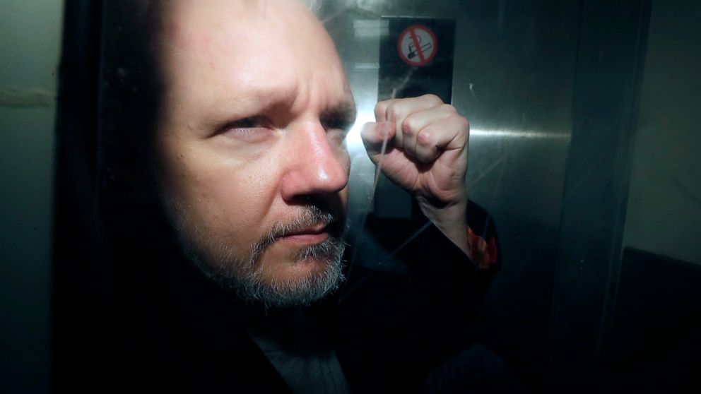 FILE - WikiLeaks founder Julian Assange being taken from court, where he appeared on charges of jumping British bail seven years ago, in London, Wednesday May 1, 2019. Britain's High Court is set to rule on whether WikiLeaks founder Julian Assange ca