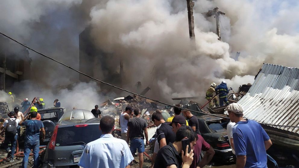 Smoke rises from Surmalu market about two kilometers (1.2 miles) south of the center Yerevan, Armenia, Sunday, Aug. 14, 2022. A strong explosion hit a large market in the capital of Armenia on Sunday, setting off a fire and reportedly trapping people