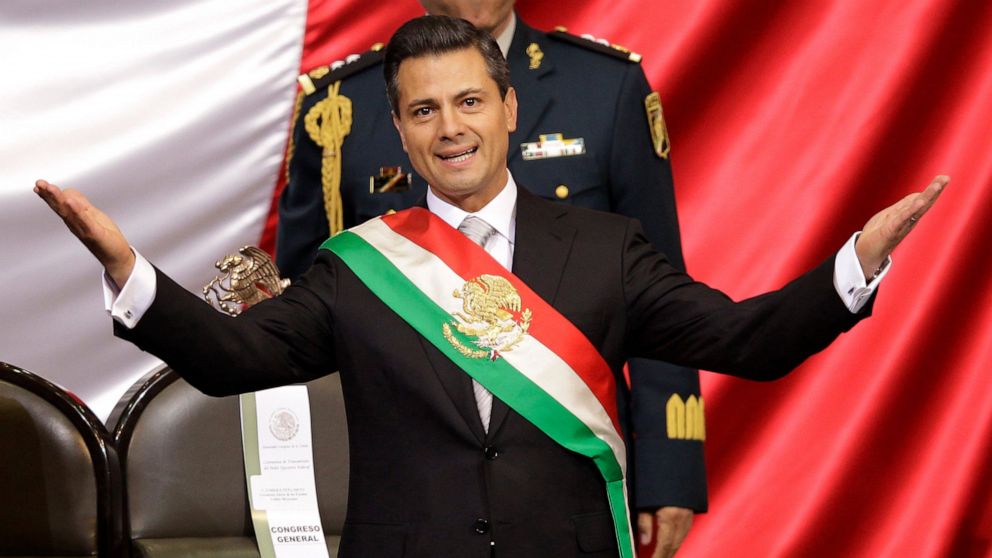 FILE - Mexico's incoming President Enrique Pena Nieto of the Institutional Revolution Party (PRI) wears the presidential sash after being sworn-in at his inauguration ceremony before Congress in Mexico City, Dec. 1, 2012. Mexico’s anti-money launderi
