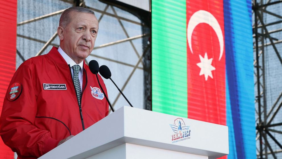 Turkey's President Recep Tayyip Erdogan speaks at a Turkish Technology and Aviation festival, held abroad for the first time, in Baku, Azerbaijan, Saturday, May 28, 2022. Azerbaijan's President Ilham Aliyev also attended the festival to address the p