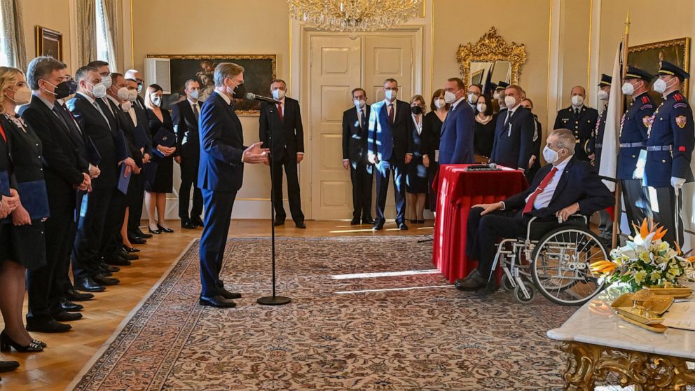 Czech President Milos Zeman (in a wheelchair) appoints the ministers of the new Czech five-party cabinet led by Petr Fiala (Civic Democrats), comprising also the Mayors and Independents, Christian Democrats, TOP 09 and the Pirates, at the presidentia