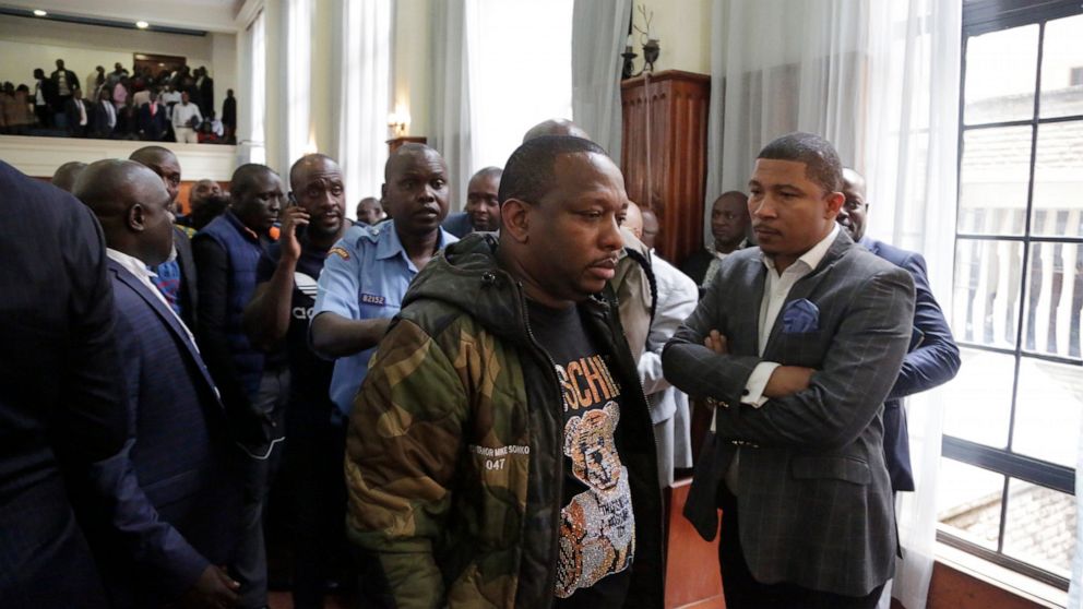 Nairobi governor Mike Gideon Mbuvi appears with other suspects accused of corruption, at the Mililani law court in Nairobi, Kenya, Monday Dec. 9, 2019. The flamboyant governor of Kenya's capital city, Nairobi, has been charged with 19 counts of graft