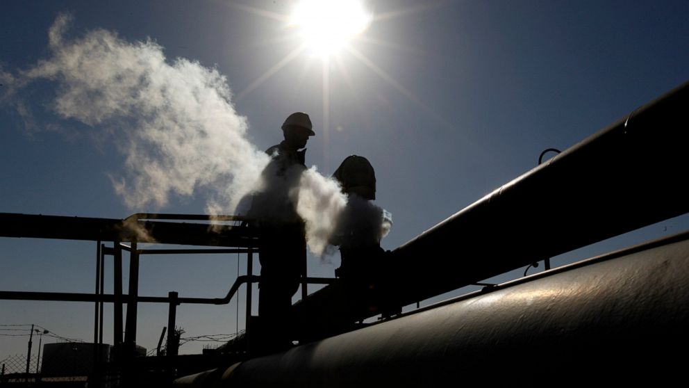 FILE - In this Feb. 26, 2011 file photo, a Libyan oil worker, works at a refinery inside the Brega oil complex, in Brega, eastern Libya. On Sunday, Jan. 19, 2020, Libya’s National Oil Corporation said that guards under the command of Khalifa Hifter’s