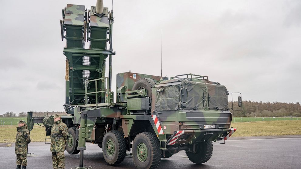 FILE - Ready-for-combat "Patriot" anti-aircraft missile systems of the German forces Bundeswehr's anti-aircraft missile squadron 1 stand on the airfield of military airport during a media presentation in Schwesing, Germany, March 17, 2022. Polish lea