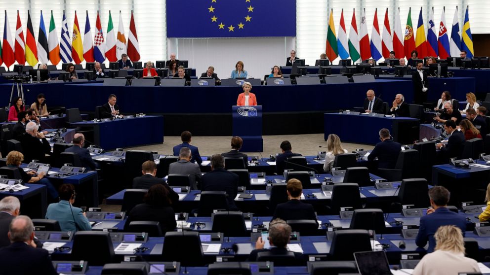 European Commission President Ursula von der Leyen, center, speaks during a commission on Russia's escalation of its war of aggression against Ukraine, at the European Parliament, Wednesday, Oct. 5, 2022, in Strasbourg, eastern France. (AP Photo/Jean