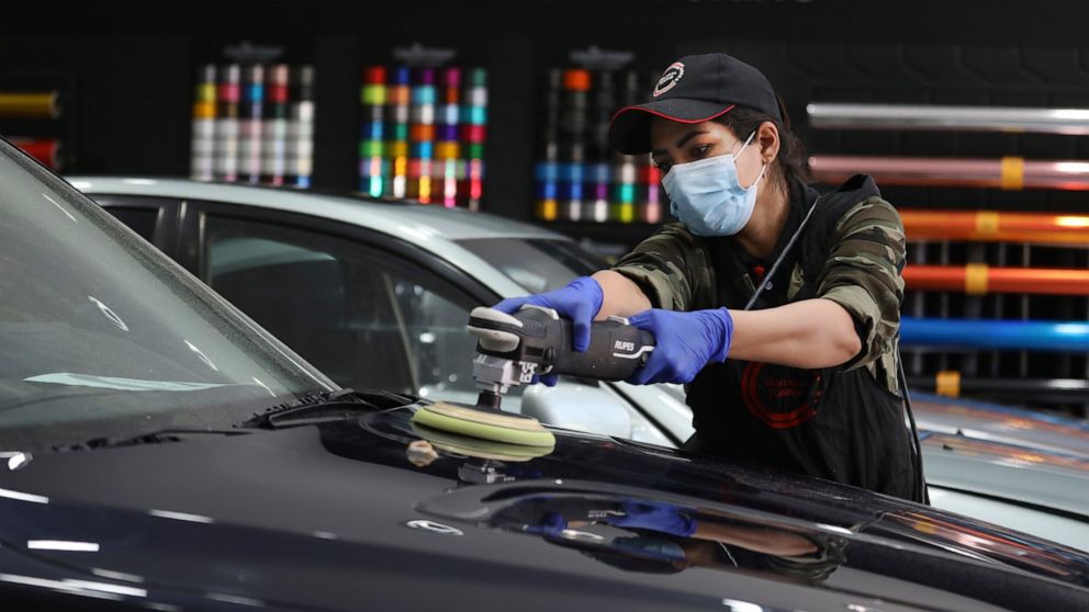 At Tehran garage, Iranian woman polishes cars and her dreams