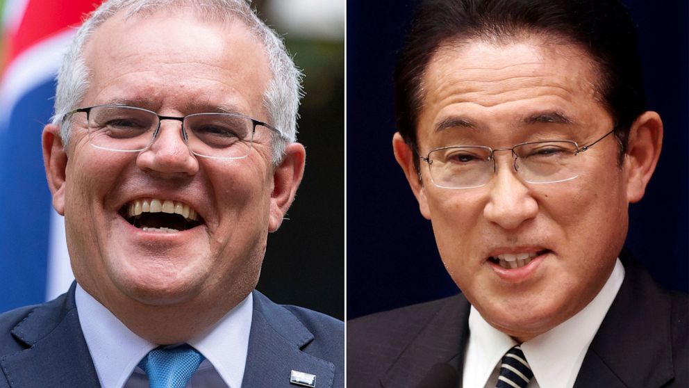 FILE - This combination of photos shows Australian Prime Minister Scott Morrison in London on June 15, 2021 and Japanese Prime Minister Fumio Kishida in Tokyo on Dec. 21, 2021. Australia and Japan will sign a treaty on Thursday, Jan. 6, 2022 to incre