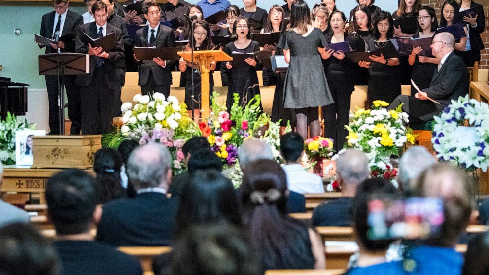 A choir sings during a memorial service for Yingying Zhang, Friday, Aug. 9, 2019 at the First Baptist Church in Savoy, Ill. The family of Yingying Zhang, a Chinese scholar whose body was never recovered after her 2017 slaying gathered at a memorial s