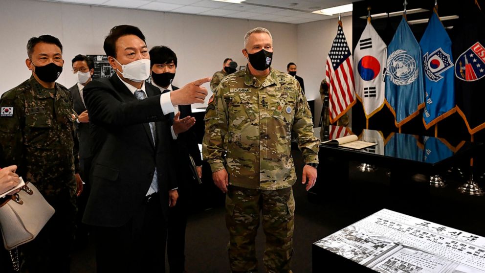 FILE - In this photo provided by South Korean President-elect office via Yonhap News Agency, South Korean President-elect Yoon Suk Yeol, second from left, speaks as Gen. Paul LaCamera, right, commander of USFK and the South Korea-U.S. Combined Forces