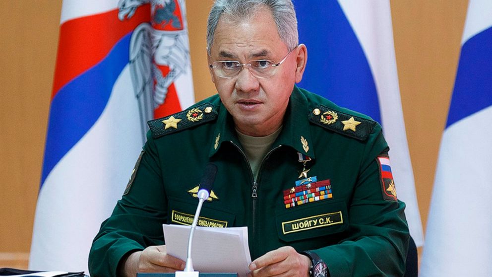 In this handout photo released by Russian Defense Ministry Press Service, Russian Defense Minister Sergei Shoigu speaks as he visits a naval base in in Gadzhiyevo, Russia, Tuesday, April 13, 2021. Shoigu on Tuesday described a massive military buildu