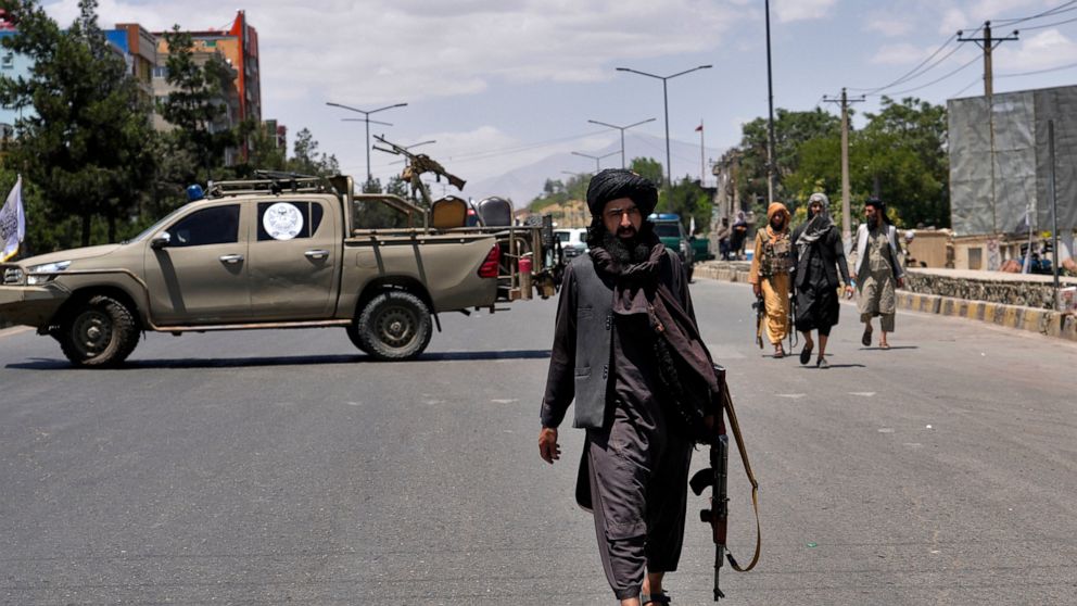 Taliban fighters guard at the site of an explosion in Kabul, Afghanistan, Saturday, June 18, 2022. Several explosions and gunfire ripped through a Sikh temple in Afghanistan's capital. (AP Photo/Ebrahim Noroozi)