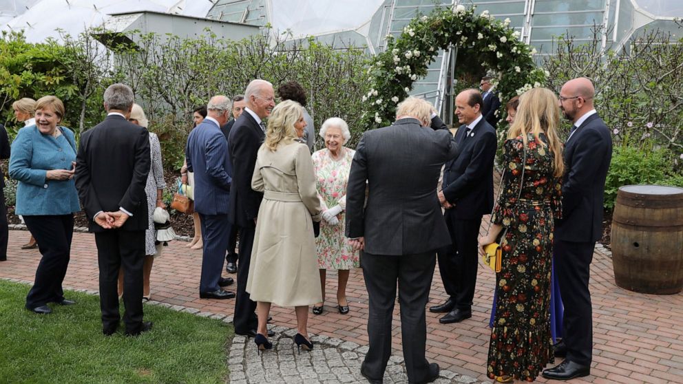 Britain's Queen Elizabeth II speaks to US President Joe Biden and his wife Jill Biden during a reception with the G7 leaders at the Eden Project in Cornwall, England, Friday June 11, 2021, during the G7 summit. (Jack Hill/Pool via AP)