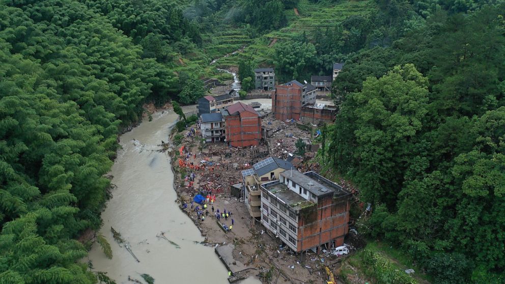 Rescuers search for victims of a landslide triggered by Typhoon Lekima in Yongjia county in eastern China's Zhejiang province on Saturday, Aug. 10, 2019. The official Xinhua News Agency says more than 1 million people were evacuated in coastal Zhejia