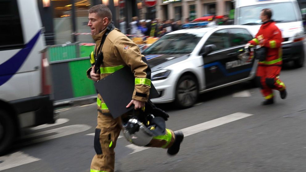 A firefighter rushes to the scene of a gas leak explosion in Paris, France, Saturday, Jan. 12, 2019. A powerful explosion and fire apparently caused by a gas leak at a Paris bakery Saturday injured several people, blasted out windows and overturned c