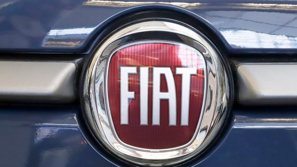 FILE - In this Feb. 14, 2019, file photo, this is the Fiat logo is mounted on a 2019 500 L on display at the 2019 Pittsburgh International Auto Show in Pittsburgh. French carmaker Renault looks set to give its approval to Fiat Chrysler's merger offer