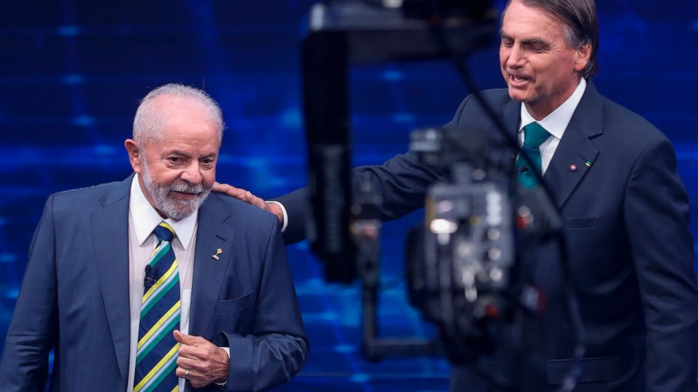 Brazil's former President Luiz Inacio Lula da Silva, who is running for office again, left, faces Jair Bolsonaro in a presidential debate at Bandeirantes Television in Sao Paulo, Brazil, Sunday, Oct. 16, 2022. The presidential runoff election is set 