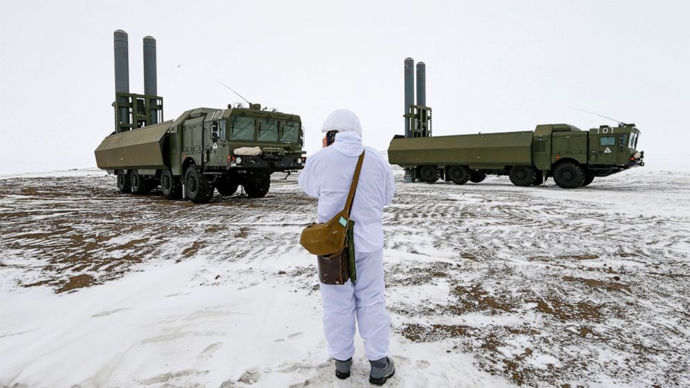 An officer speaks on walkie-talkie as the Bastion anti-ship missile systems take positions on the Alexandra Land island near Nagurskoye, Russia, Monday, May 17, 2021. Bristling with missiles and radar, Russia's northernmost military base projects the