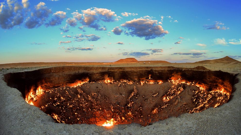 The crater fire named "Gates of Hell" is seen near Darvaza, Turkmenistan, Saturday, July 11, 2020. The president of Turkmenistan is calling for an end to one of the country's most notable but infernal sights — the blazing desert natural gas crater wi
