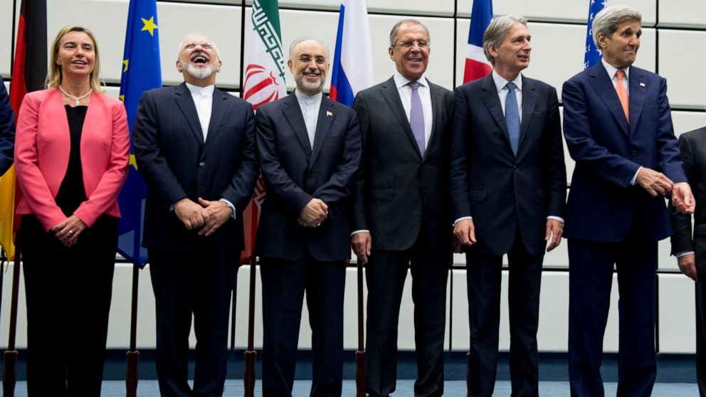FILE - In this July 14, 2015 file photo, from left to right: European Union High Representative Federica Mogherini, Iranian Foreign Minister Mohammad Javad Zarif, Head of the Iranian Atomic Energy Organization Ali Akbar Salehi, Russian Foreign Minist