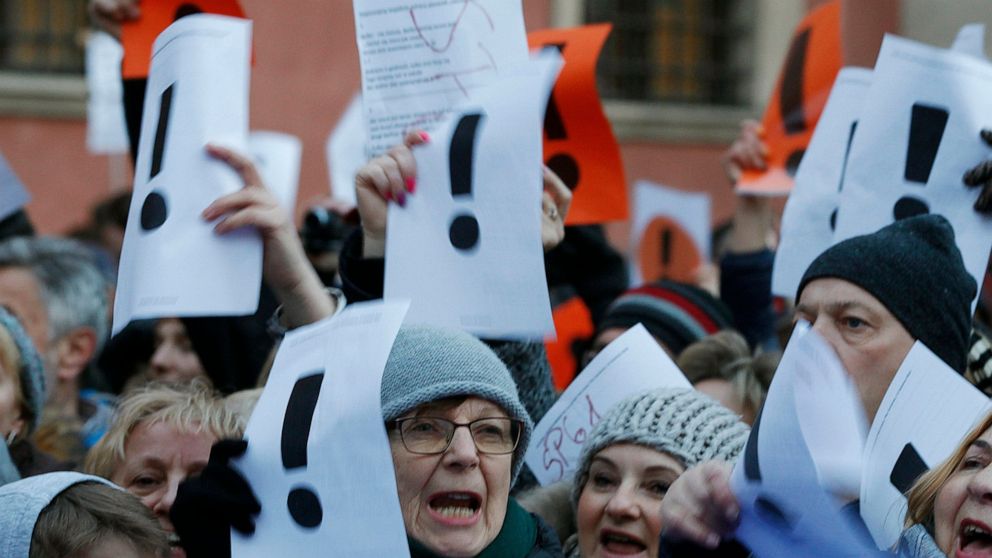 Warsaw residents gathered in the city's Old Town to show support for the striking teachers' whose nationwide pay protest has been going for five days without any signs the government could grant their demands, in Warsaw, Poland, Friday, April 12, 2019. Similar rallies were held in some other cities.(AP Photo/Czarek Sokolowski)