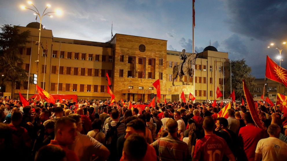 FILE - People protest in front of the parliament building in Skopje, North Macedonia, late Tuesday, July 5, 2022. Nightly protests in North Macedonia over the past week have left dozens injured. At the heart of the turmoil is the small Balkan country