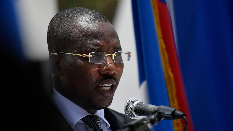 File - Then Interim Prime Minister Claude Joseph speaks during a memorial service for the late Haitian President Jovenel Moise, in Port-au-Prince, Haiti, July 20, 2021. Dominican President Luis Abinader signed an order on Wednesday, Sept. 7, 2022, th